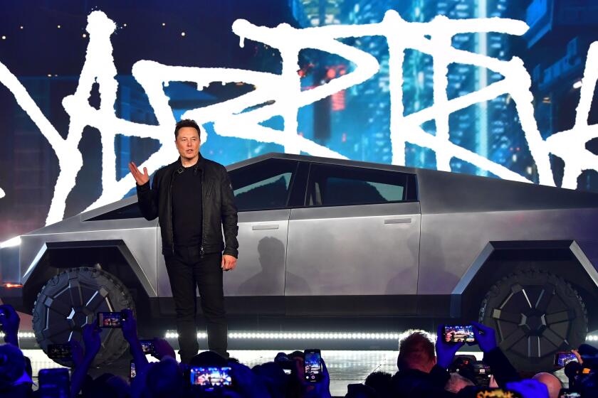 Tesla co-founder and CEO Elon Musk introduces the newly unveiled all-electric battery-powered Tesla Cybertruck at Tesla Design Center in Hawthorne, California on November 21, 2019. (Photo by Frederic J. BROWN / AFP) (Photo by FREDERIC J. BROWN/AFP via Getty Images)